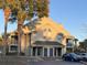 Condo building exterior, featuring light-colored siding and a central entrance at 6088 Westgate Dr # 103, Orlando, FL 32835