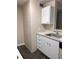 White kitchen cabinets, granite countertop, and sink at 6088 Westgate Dr # 103, Orlando, FL 32835