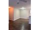 Cozy living room featuring wood flooring and neutral wall color at 6088 Westgate Dr # 103, Orlando, FL 32835