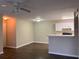 Living room features dark wood-look vinyl flooring at 6088 Westgate Dr # 103, Orlando, FL 32835