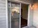 Glass sliding door opens to a small patio at 6088 Westgate Dr # 103, Orlando, FL 32835