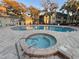 Community pool and spa with surrounding patio at 6088 Westgate Dr # 103, Orlando, FL 32835