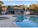 Community pool and spa with covered seating area at 6088 Westgate Dr # 103, Orlando, FL 32835