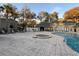 Community pool and spa with surrounding patio at 6088 Westgate Dr # 103, Orlando, FL 32835
