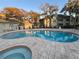 Community pool and spa with surrounding patio at 6088 Westgate Dr # 103, Orlando, FL 32835