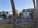 Community tennis court with surrounding fence at 6088 Westgate Dr # 103, Orlando, FL 32835