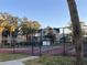 Community tennis court with surrounding fence at 6088 Westgate Dr # 103, Orlando, FL 32835