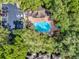 An aerial view of the pool and surrounding area, showcasing a lush setting and convenient parking at 686 Roaring Dr # 343, Altamonte Springs, FL 32714