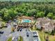 This aerial shot showcases community amenities, lush trees, and nearby parking at this great condominium complex at 686 Roaring Dr # 343, Altamonte Springs, FL 32714