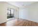 Bedroom with wood floors, closet, and sliding doors to a porch or patio at 686 Roaring Dr # 343, Altamonte Springs, FL 32714