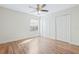 Bedroom with wood floors, a window for natural light, and two large closets at 686 Roaring Dr # 343, Altamonte Springs, FL 32714