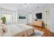 Primary bedroom with an en-suite bathroom, wood floors, and a ceiling fan at 686 Roaring Dr # 343, Altamonte Springs, FL 32714