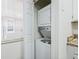 This laundry area features a stacked washer and dryer setup, perfect for saving space in your home at 686 Roaring Dr # 343, Altamonte Springs, FL 32714