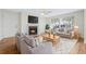 Inviting living room with fireplace, hardwood floors, and a comfortable seating area bathed in natural light at 686 Roaring Dr # 343, Altamonte Springs, FL 32714