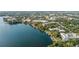 Aerial lake view of a waterfront condo with boat docks and lakeside condos at 690 Osceola Ave # 604, Winter Park, FL 32789