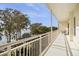 A bright and open balcony overlooking the lake and mature trees at 690 Osceola Ave # 604, Winter Park, FL 32789
