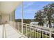 A bright and open balcony overlooking the lake with seating area at 690 Osceola Ave # 604, Winter Park, FL 32789