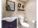 Cozy bathroom with modern vanity, a framed mirror, neutral color palette, and a convenient toilet paper holder at 690 Osceola Ave # 604, Winter Park, FL 32789