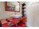 Modern bathroom with a unique sink, sleek fixtures, and contemporary shelving for storage and decor at 690 Osceola Ave # 604, Winter Park, FL 32789
