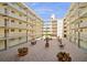 Open-air courtyard featuring outdoor seating, lush greenery, and an inviting atmosphere for residents and guests at 690 Osceola Ave # 604, Winter Park, FL 32789