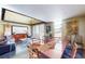 Bright dining area with high ceilings, a large table perfect for gatherings, and expansive windows for great natural light at 690 Osceola Ave # 604, Winter Park, FL 32789