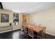 Inviting dining area featuring a sleek table, ample seating, elegant décor, and a large window with serene outdoor views at 690 Osceola Ave # 604, Winter Park, FL 32789