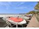 Dock view of boats parked with serene water view and blue skies at 690 Osceola Ave # 604, Winter Park, FL 32789