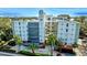 Modern condo building in a lakeside community with lush landscape and secure access at 690 Osceola Ave # 604, Winter Park, FL 32789
