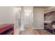 Hallway featuring tile floors, a walk-in closet, and access to a bath area with a built-in jacuzzi at 690 Osceola Ave # 604, Winter Park, FL 32789