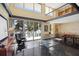 Spacious living room with vaulted ceilings, open floor plan, and views of the lake at 690 Osceola Ave # 604, Winter Park, FL 32789