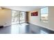 Inviting living room with hardwood floors, ample natural light, and picturesque views from the balcony at 690 Osceola Ave # 604, Winter Park, FL 32789