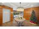 Well-lit lobby featuring a decorative table, festive holiday tree, and elegant chandelier at 690 Osceola Ave # 604, Winter Park, FL 32789