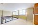 Open loft area with railings, large windows, and built-in shelving at 690 Osceola Ave # 604, Winter Park, FL 32789