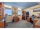 Home office with built-in shelving, dual desk areas, and a walk-in closet at 690 Osceola Ave # 604, Winter Park, FL 32789