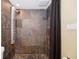 Modern shower with striking tile work, rainfall shower head, and sleek design, offering a spa-like experience at 690 Osceola Ave # 604, Winter Park, FL 32789