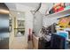 View of storage area with shelving for supplies and mechanical access, including a glimpse of the hallway beyond at 690 Osceola Ave # 604, Winter Park, FL 32789