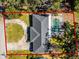 Aerial view showing a home with a pool and a circular driveway at 718 32Nd St, Orlando, FL 32806