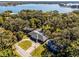 Aerial view of house with a pool near the lake at 718 32Nd St, Orlando, FL 32806