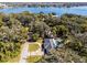 Aerial view of house, pool, and large lot near lake at 718 32Nd St, Orlando, FL 32806