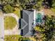 Aerial view showing a home with a pool and a circular driveway at 718 32Nd St, Orlando, FL 32806