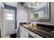Bathroom with granite countertop, double sink, and large mirror at 718 32Nd St, Orlando, FL 32806
