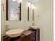 Bathroom with double sink, vessel sinks, and dark brown vanity at 718 32Nd St, Orlando, FL 32806