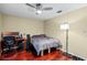 Bedroom with wood floors, ceiling fan, and a workspace at 718 32Nd St, Orlando, FL 32806