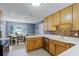 Bright kitchen with wood cabinets, breakfast nook, and tile flooring at 718 32Nd St, Orlando, FL 32806