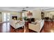 Bright living room with hardwood floors, fireplace, and built-in entertainment center at 718 32Nd St, Orlando, FL 32806