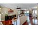 Living room with hardwood floors, large TV, and comfortable seating at 718 32Nd St, Orlando, FL 32806