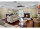 Spacious living area with hardwood floors, fireplace, and plenty of natural light at 718 32Nd St, Orlando, FL 32806