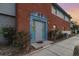 Charming townhouse with brick exterior and beautiful blue trim around the front door at 7340 Daniel Webster Dr # 7, Winter Park, FL 32792