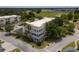 An aerial view showcasing the building's exterior and surrounding area at 7521 Mourning Dove Cir # 303, Reunion, FL 34747
