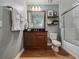 Clean bathroom with single vanity and bathtub at 7521 Mourning Dove Cir # 303, Reunion, FL 34747